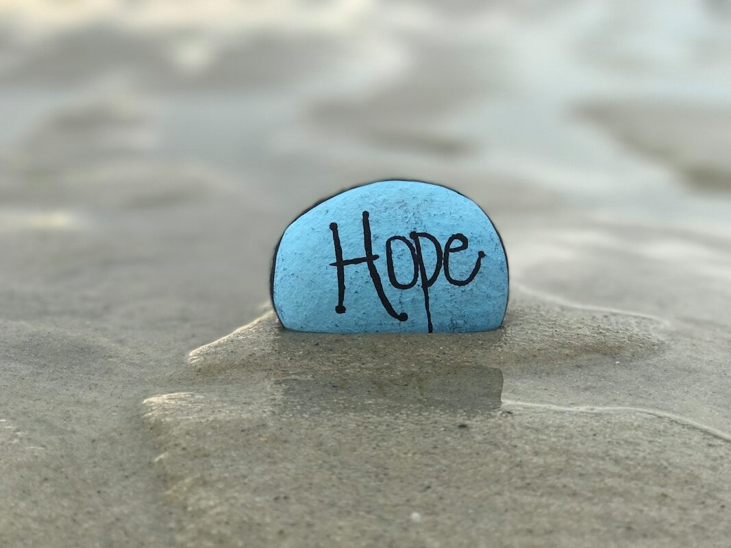 gray hope-printed stone in